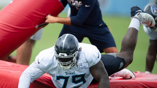 Tennessee Titans tackle Isaiah Wilson (79) slides off a pad during tackling drills at practice at Saint Thomas Sports Park Monday, Aug. 31, 2020 Nashville, Tenn.